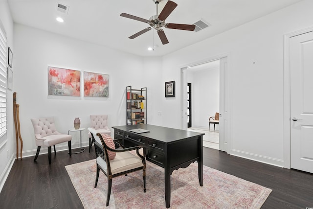 office area featuring ceiling fan and dark wood-type flooring