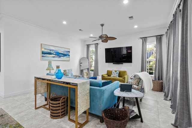 tiled living room featuring crown molding, plenty of natural light, and ceiling fan