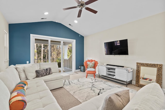 carpeted living room featuring ceiling fan and vaulted ceiling