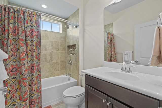 full bathroom featuring shower / bath combo, vanity, and toilet