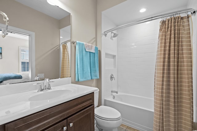 full bathroom with shower / bath combo with shower curtain, vanity, and toilet