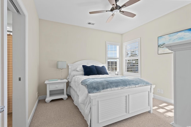 bedroom featuring ceiling fan and light colored carpet