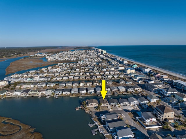 bird's eye view featuring a beach view and a water view