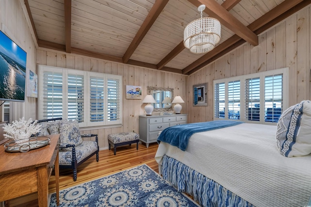 bedroom with lofted ceiling with beams, light hardwood / wood-style floors, wooden ceiling, and a chandelier