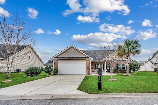 view of front of house featuring central AC, a garage, and a front lawn