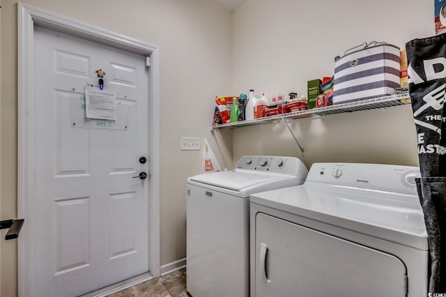 clothes washing area with washer and dryer