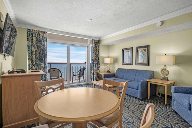 dining area featuring a textured ceiling and crown molding