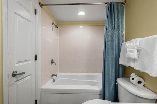 bathroom with shower / bath combo and toilet