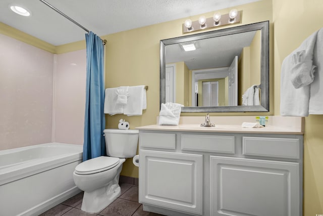 full bathroom featuring shower / bath combo, tile patterned floors, a textured ceiling, toilet, and vanity