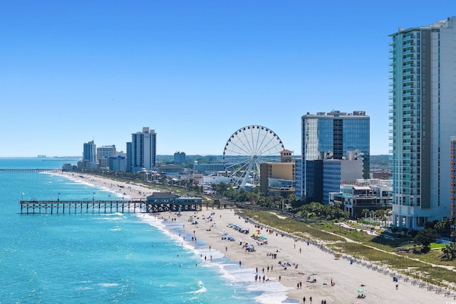 drone / aerial view featuring a view of the beach and a water view