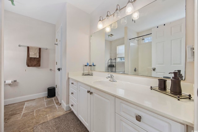 bathroom featuring vanity and a shower