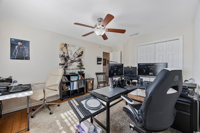 office space with ceiling fan and wood-type flooring