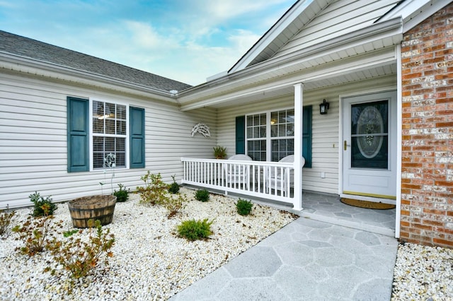 entrance to property featuring a porch