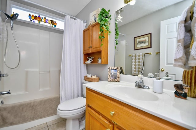 bathroom with vanity, toilet, and tile patterned flooring