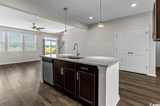 kitchen featuring stainless steel dishwasher, decorative light fixtures, ceiling fan, and sink