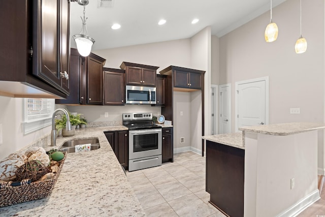 kitchen featuring stainless steel appliances, sink, light tile patterned floors, hanging light fixtures, and lofted ceiling