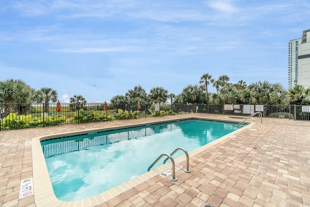 view of pool featuring a patio area