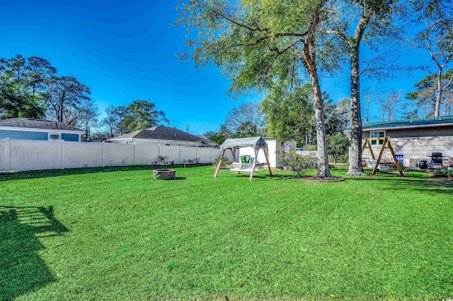 view of yard with a gazebo and an outdoor fire pit