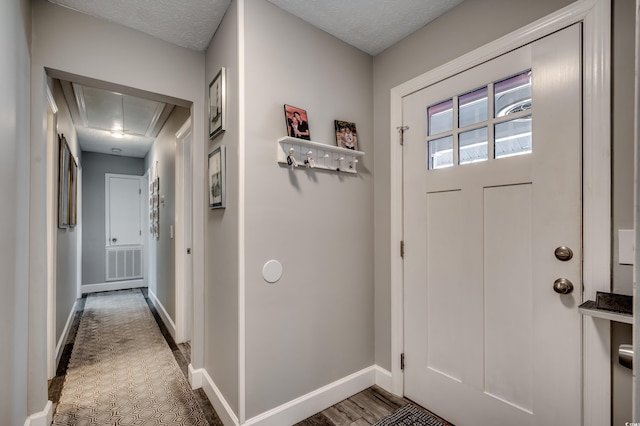 foyer featuring a textured ceiling