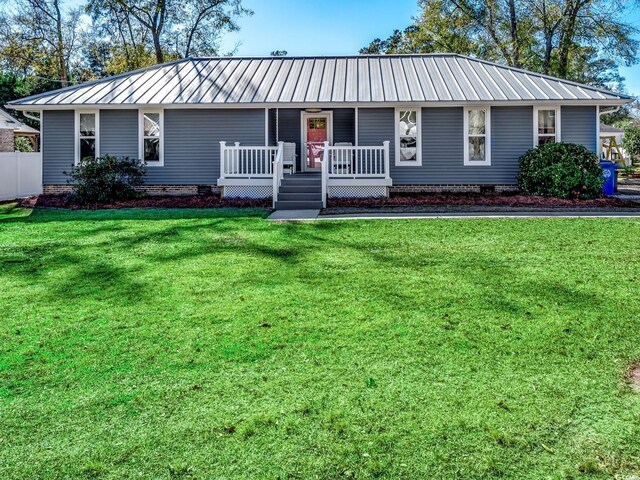 single story home featuring a front lawn