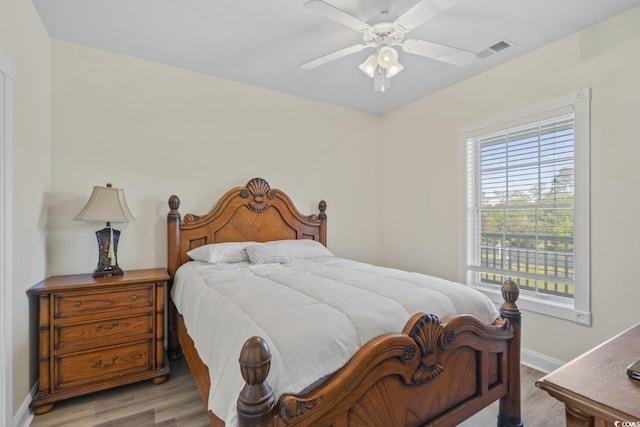 bedroom featuring light hardwood / wood-style flooring and ceiling fan