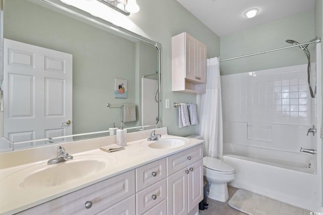 full bathroom with tile patterned floors, vanity, toilet, and shower / bath combo