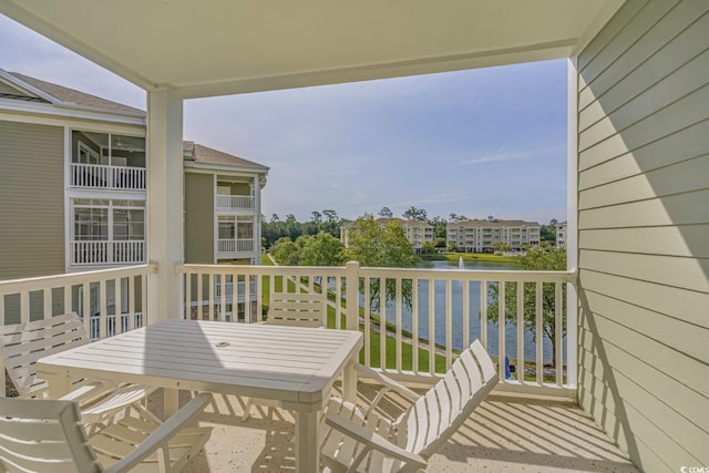 balcony featuring a water view