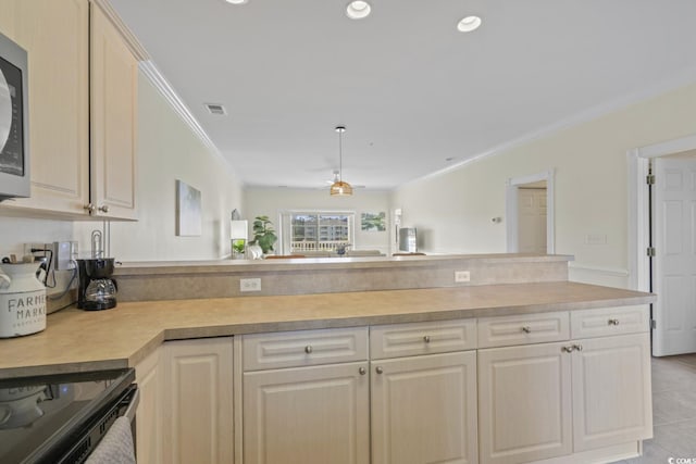 kitchen featuring ornamental molding, kitchen peninsula, and light tile patterned flooring