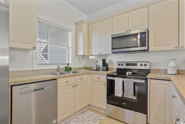 kitchen featuring stainless steel appliances, ornamental molding, and sink