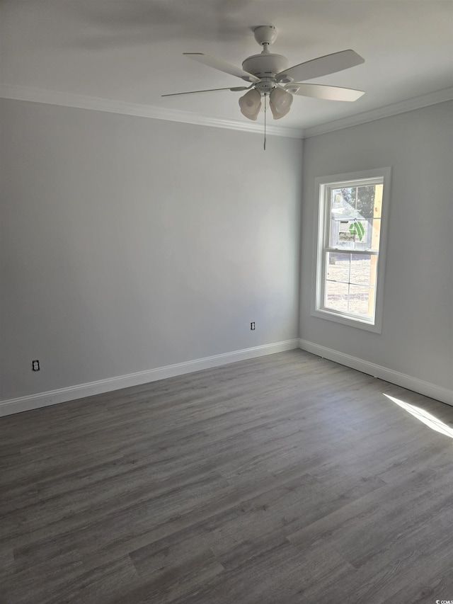 spare room with ceiling fan, dark hardwood / wood-style floors, and crown molding