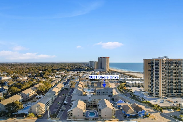 aerial view featuring a water view and a beach view