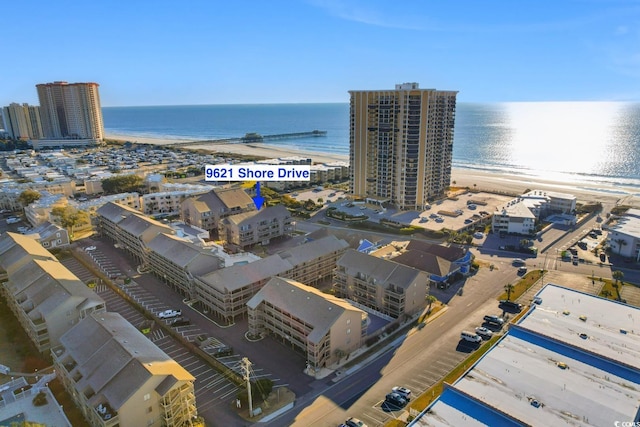 drone / aerial view with a view of the beach and a water view