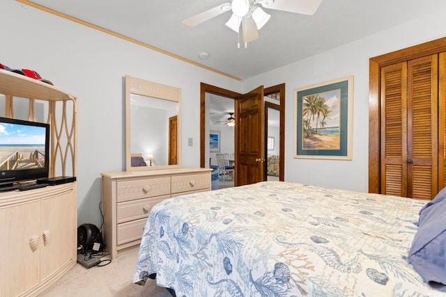 bedroom with ceiling fan and light colored carpet