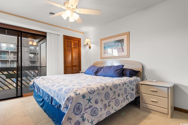 bedroom featuring ceiling fan, access to exterior, light carpet, and a closet