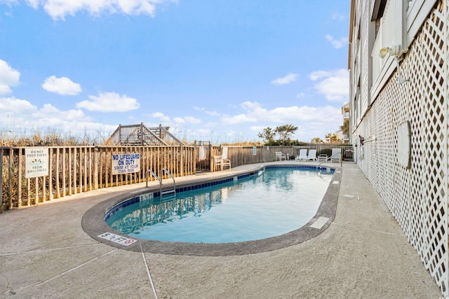 view of pool featuring a patio