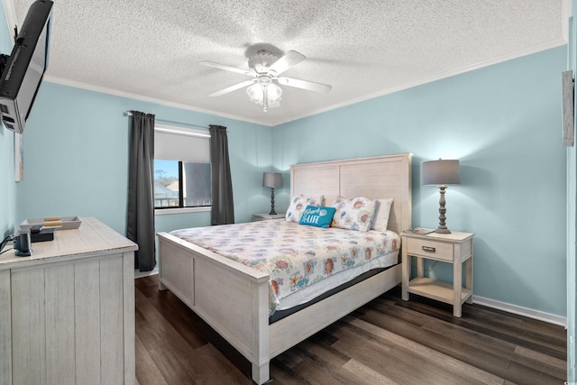 bedroom with dark hardwood / wood-style flooring, ceiling fan, and crown molding