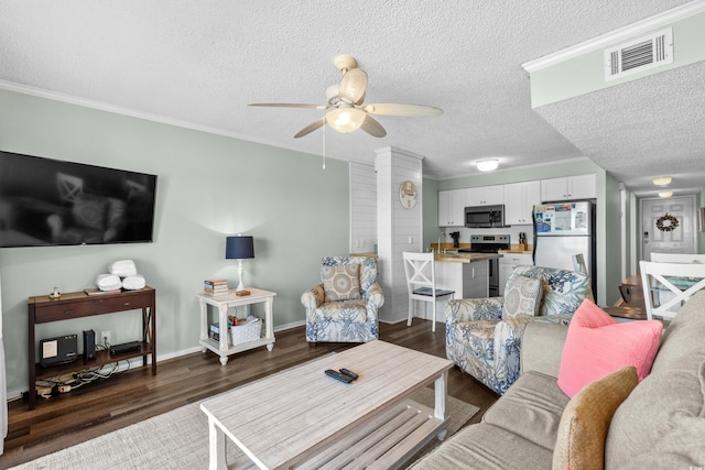 living room with a textured ceiling, ceiling fan, crown molding, and dark wood-type flooring