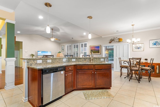 kitchen with light stone countertops, ceiling fan with notable chandelier, sink, pendant lighting, and dishwasher