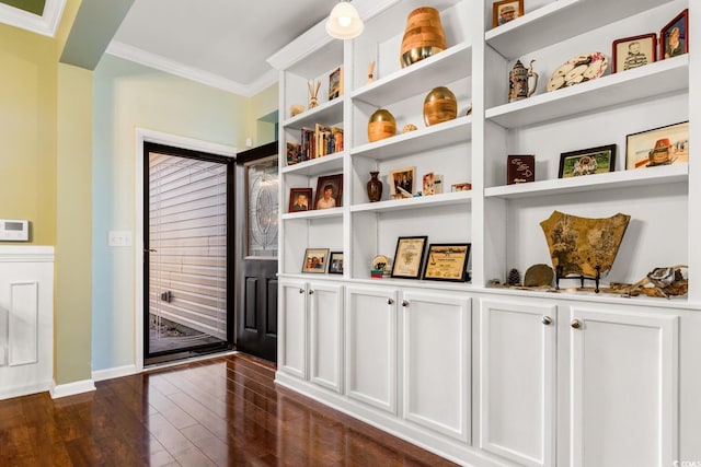 interior space with crown molding and dark hardwood / wood-style floors