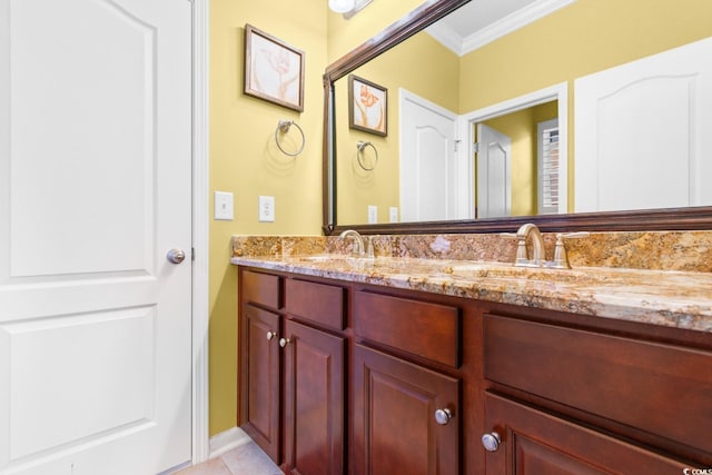 bathroom with tile patterned flooring, vanity, and ornamental molding