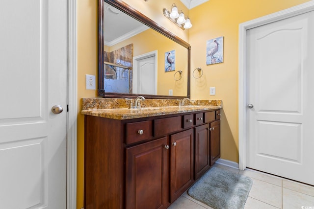 bathroom featuring tile patterned flooring, vanity, and ornamental molding