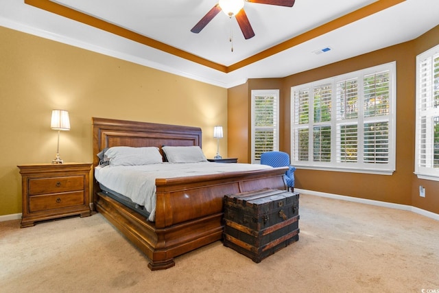 bedroom with ceiling fan and light carpet