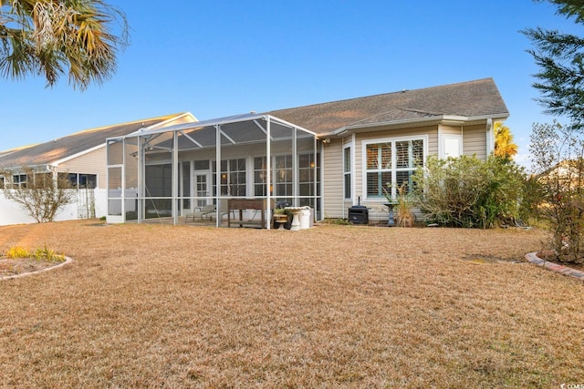 rear view of property with a lanai