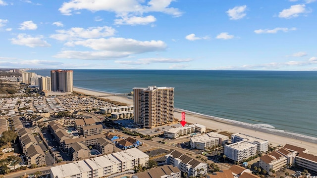 birds eye view of property featuring a view of the beach and a water view