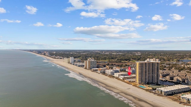 drone / aerial view featuring a water view and a beach view