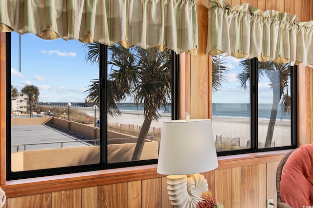 room details featuring a water view and a beach view