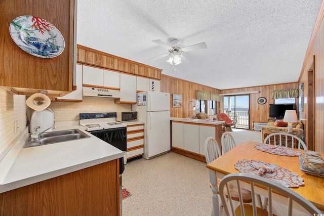 kitchen featuring ceiling fan, sink, white cabinets, and white appliances