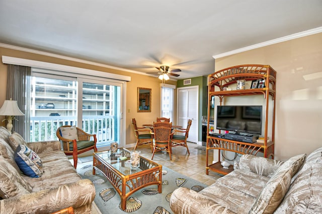 living room with ceiling fan, crown molding, and light tile patterned floors