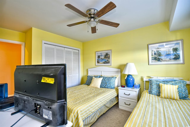 bedroom featuring carpet floors, a closet, and ceiling fan