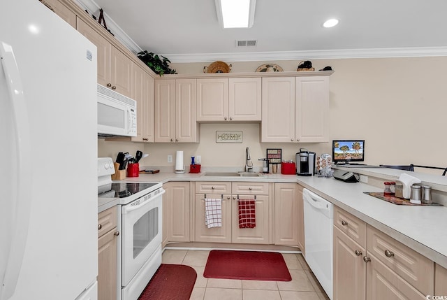 kitchen with sink, white appliances, ornamental molding, and light tile patterned flooring